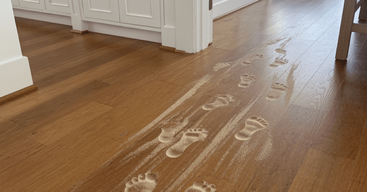 Beach home entryway in Del Mar showing sand tracked in on floors requiring deep cleaning extraction
